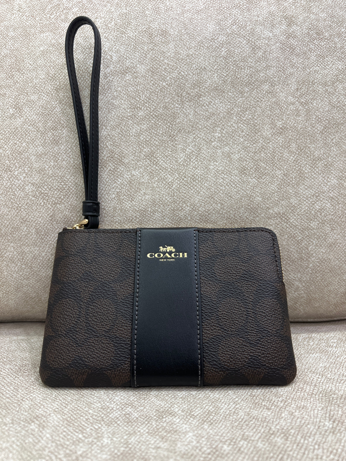 Coach Corner Zip Wristlet in Signature coated canvas and smooth leather