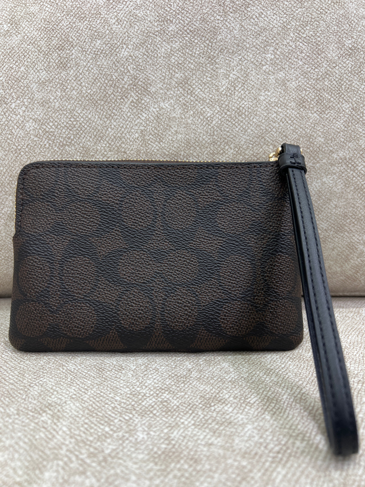 Coach Corner Zip Wristlet in Signature coated canvas and smooth leather