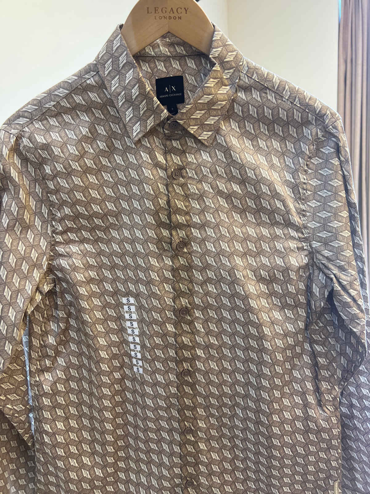 Armani Exchange beige regular fit shirt features an allover geometric logo print and is crafted from cotton satin