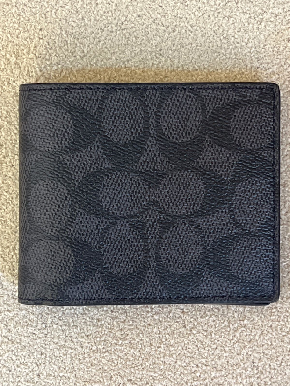 Appears to be a Coach Men's 3-in-1 Wallet in Signature Canvas.