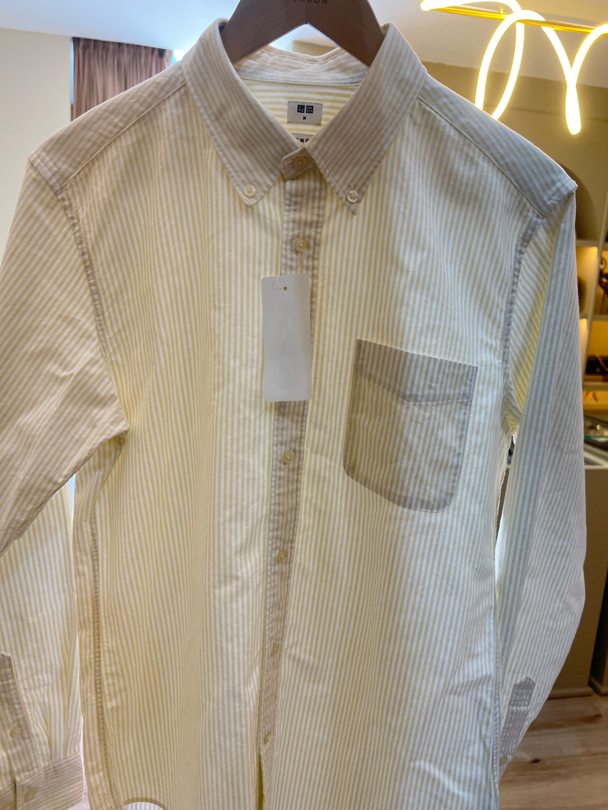 Yellow and white striped Uniqlo Men's Oxford Shirt, likely the slim-fit model