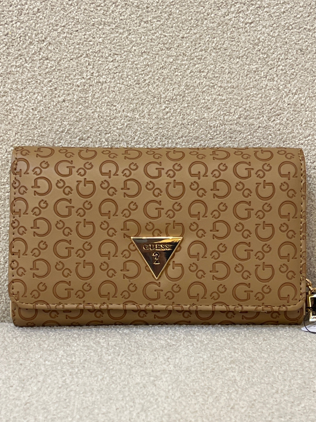 Guess Julie Phone Organizer Wallet, a brown faux-leather wristlet featuring an allover logo print and a gold-tone triangle logo on the front