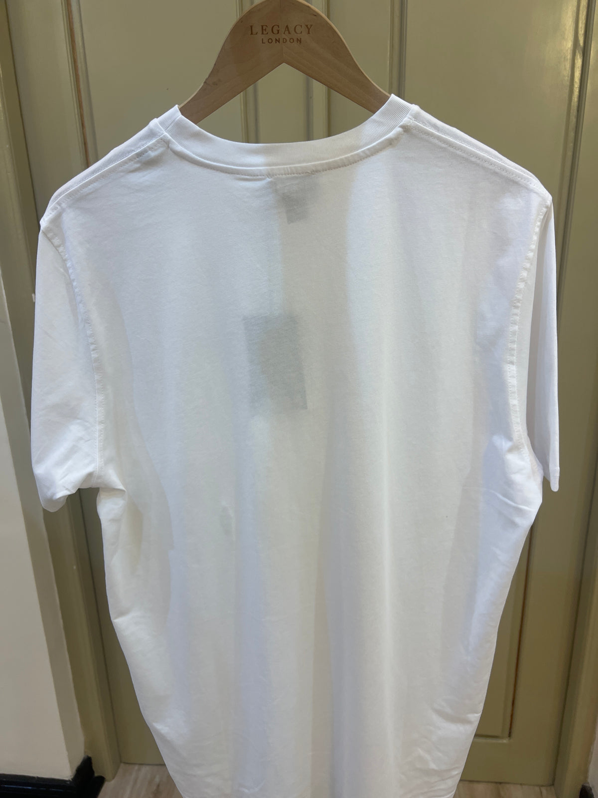 Diesel T-shirt features a small, red, white, and black jacquard logo patch on the chest