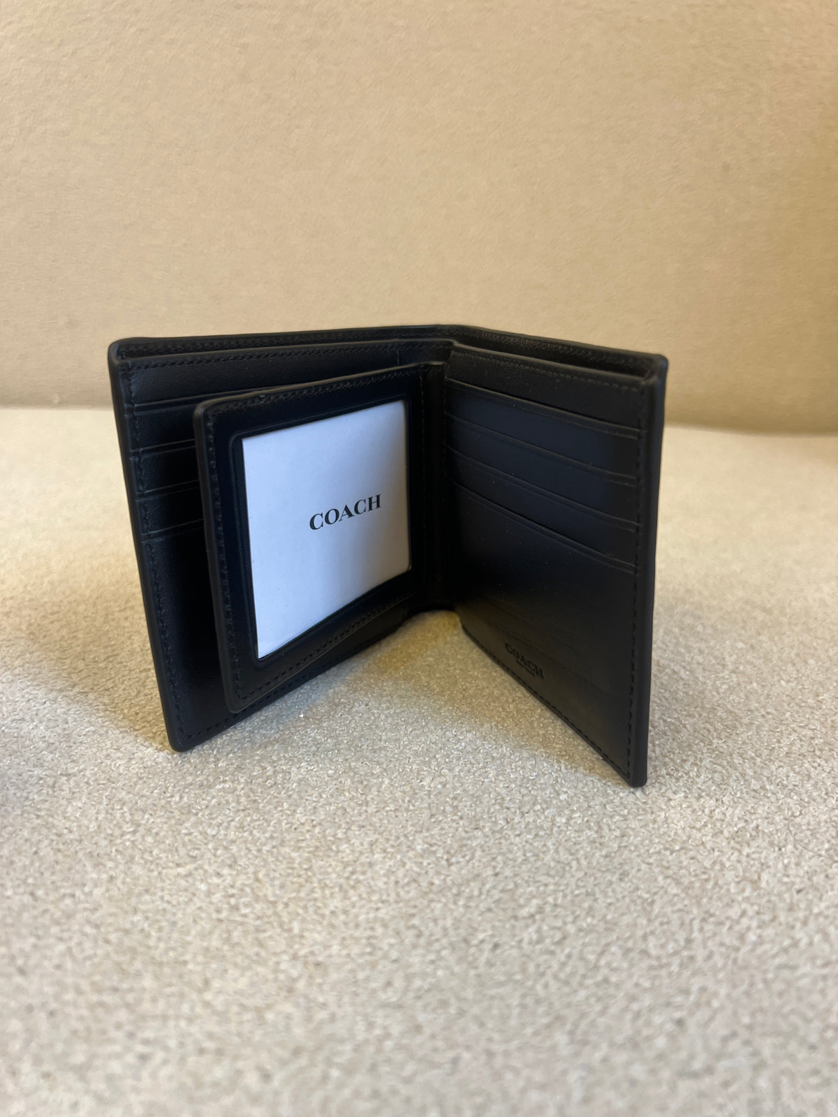 Coach 3-In-1 Wallet is crafted from signature embossed leather