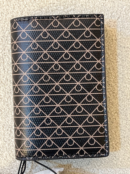 Calvin Klein wallet features a signature monogram logo motif pattern