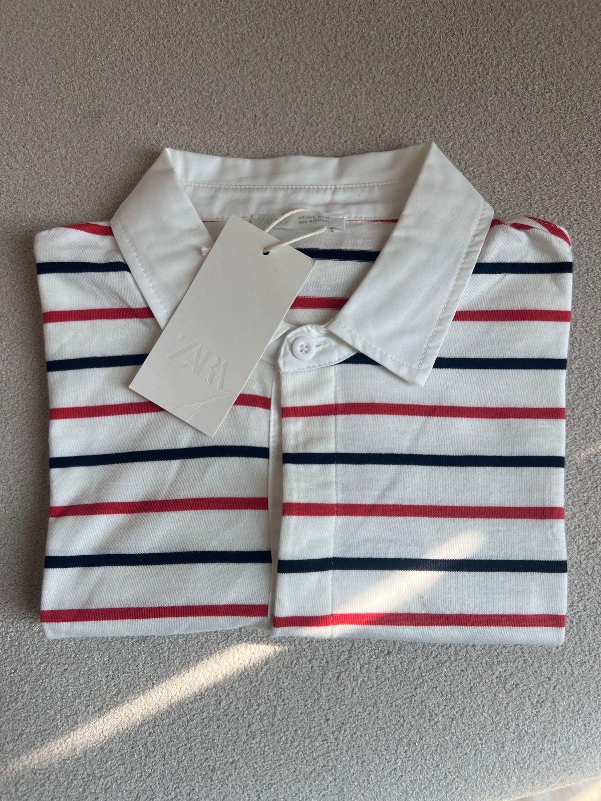 White polo ZARA T-shirt with red and black stripes, similar to those offered by brands like Liberty Blues or J.Crew Factory