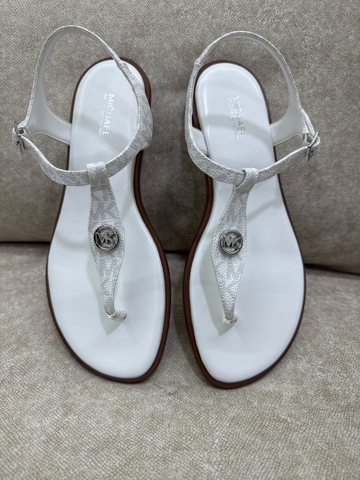Pair of Michael Kors Mallory Signature Logo T-Strap Sandals in Bright White
