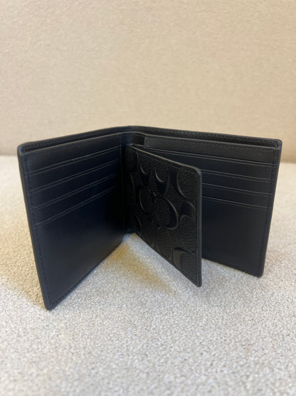 Coach 3-In-1 Wallet is crafted from signature embossed leather