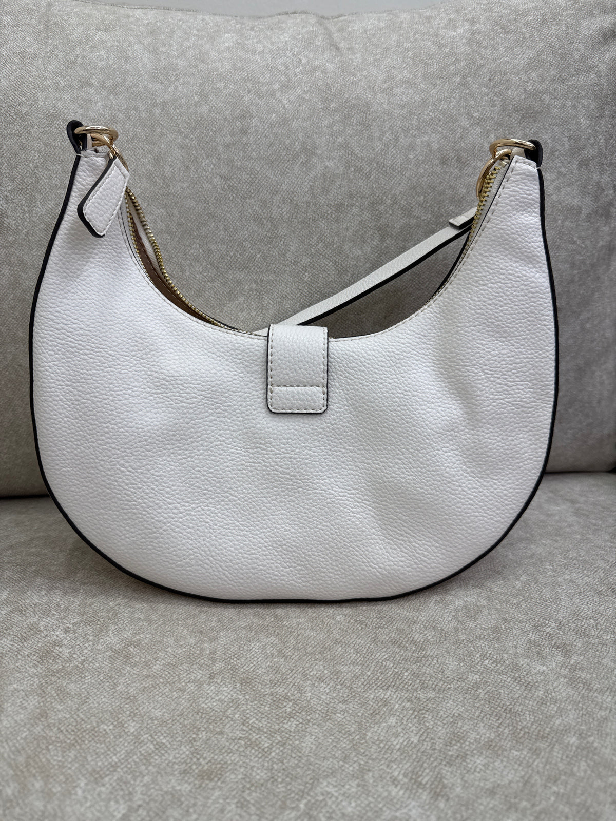 This is a white GUESS Kaline pebbled faux-leather shoulder bag