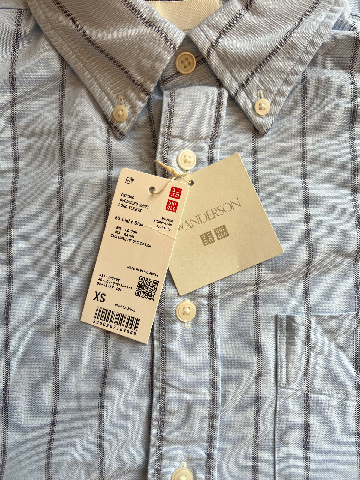 UNIQLO x JW Anderson Oxford Oversized Shirt in a striped light blue pattern