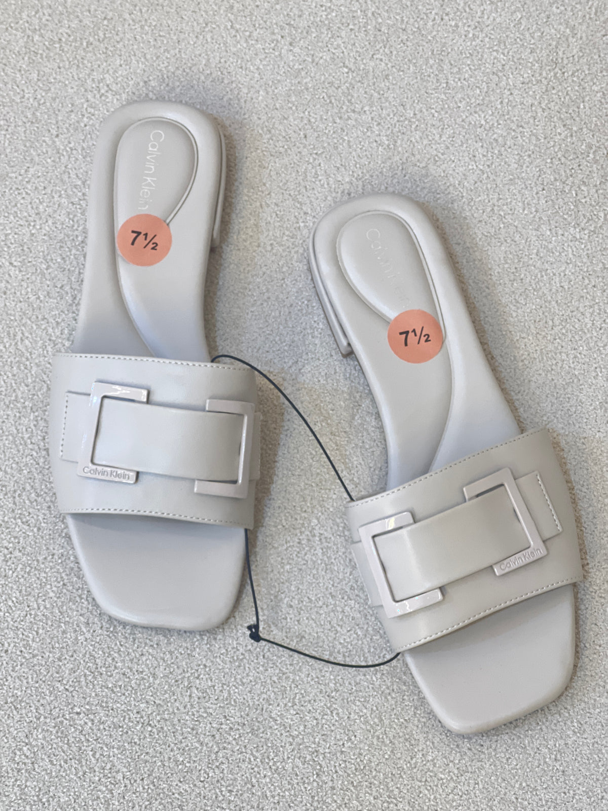 Calvin Klein Tangelo dress sandal featuring a square open toe, a wide upper strap, and a barely-there heel