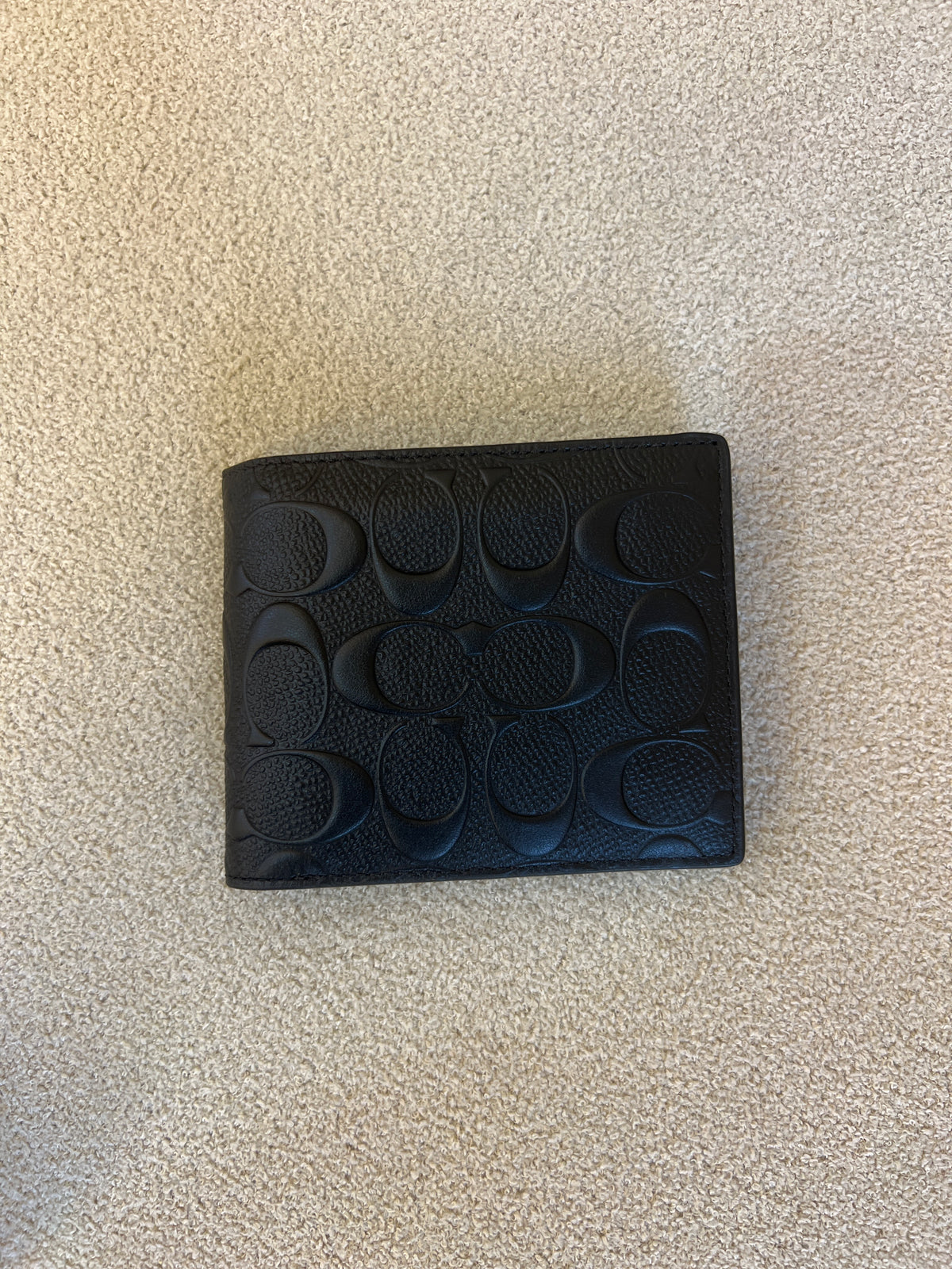 Coach 3-In-1 Wallet is crafted from signature embossed leather