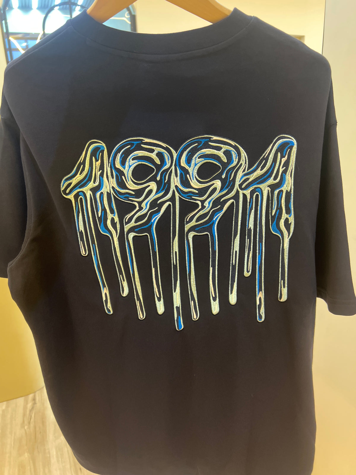 Armani Exchange crew neck t-shirt featuring a distinctive graphic logo on the chest back print graphic t-shirt featuring a stylized "1991" design Navy blue