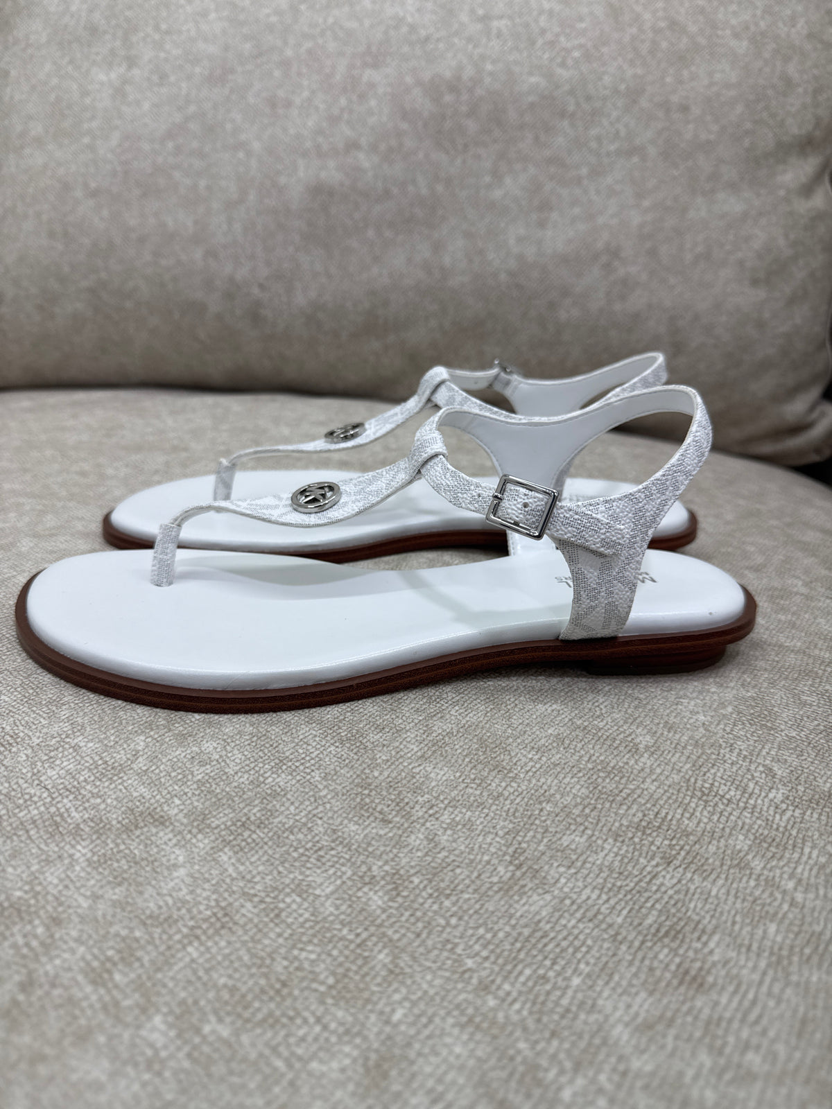 Pair of Michael Kors Mallory Signature Logo T-Strap Sandals in Bright White