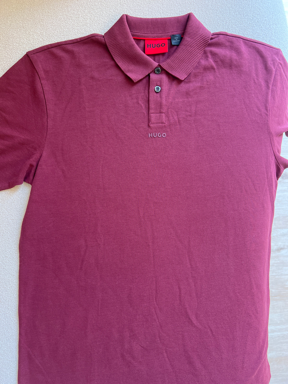 HUGO Men's Donos Logo Polo Shirt in a burgundy or dark red color