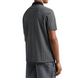 Armani Exchange men's polo shirt with a black collar and a light grey/silver all-over pattern