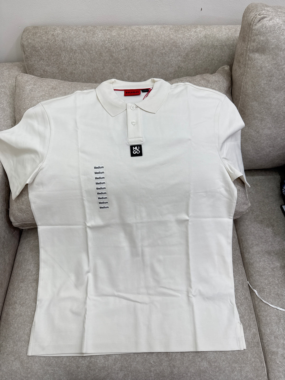 HUGO Men's white interlock-cotton polo shirt featuring a stacked-logo badge