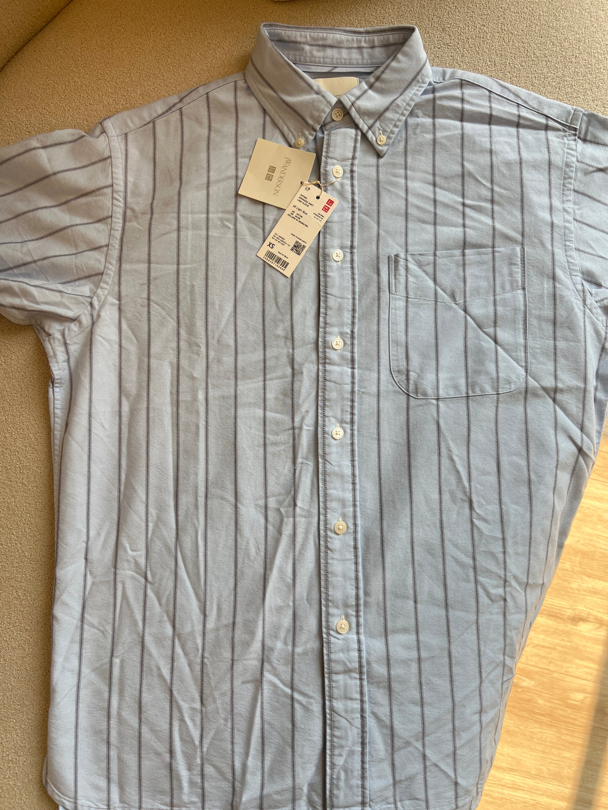 UNIQLO x JW Anderson Oxford Oversized Shirt in a striped light blue pattern