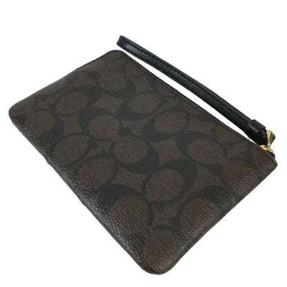 Coach Corner Zip Wristlet in Signature coated canvas and smooth leather