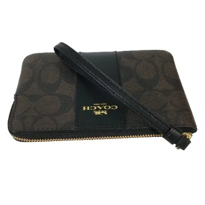 Coach Corner Zip Wristlet in Signature coated canvas and smooth leather