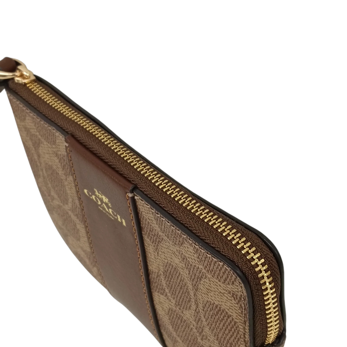 Coach Corner Zip Wristlet in signature canvas with a brown leather stripe