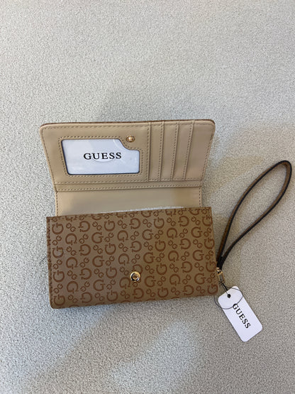 Guess Julie Phone Organizer Wallet, a brown faux-leather wristlet featuring an allover logo print and a gold-tone triangle logo on the front