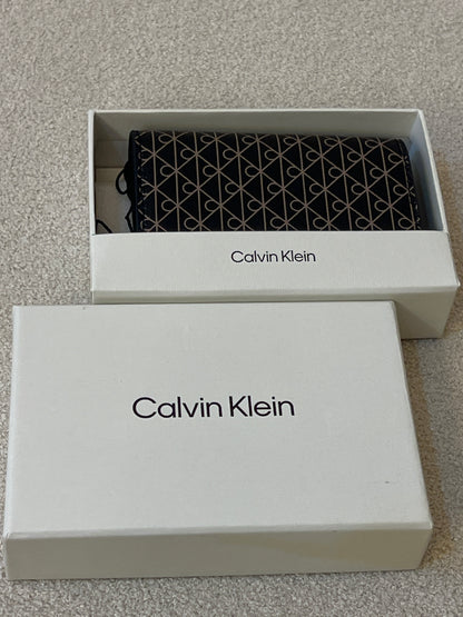 Calvin Klein wallet features a signature monogram logo motif pattern