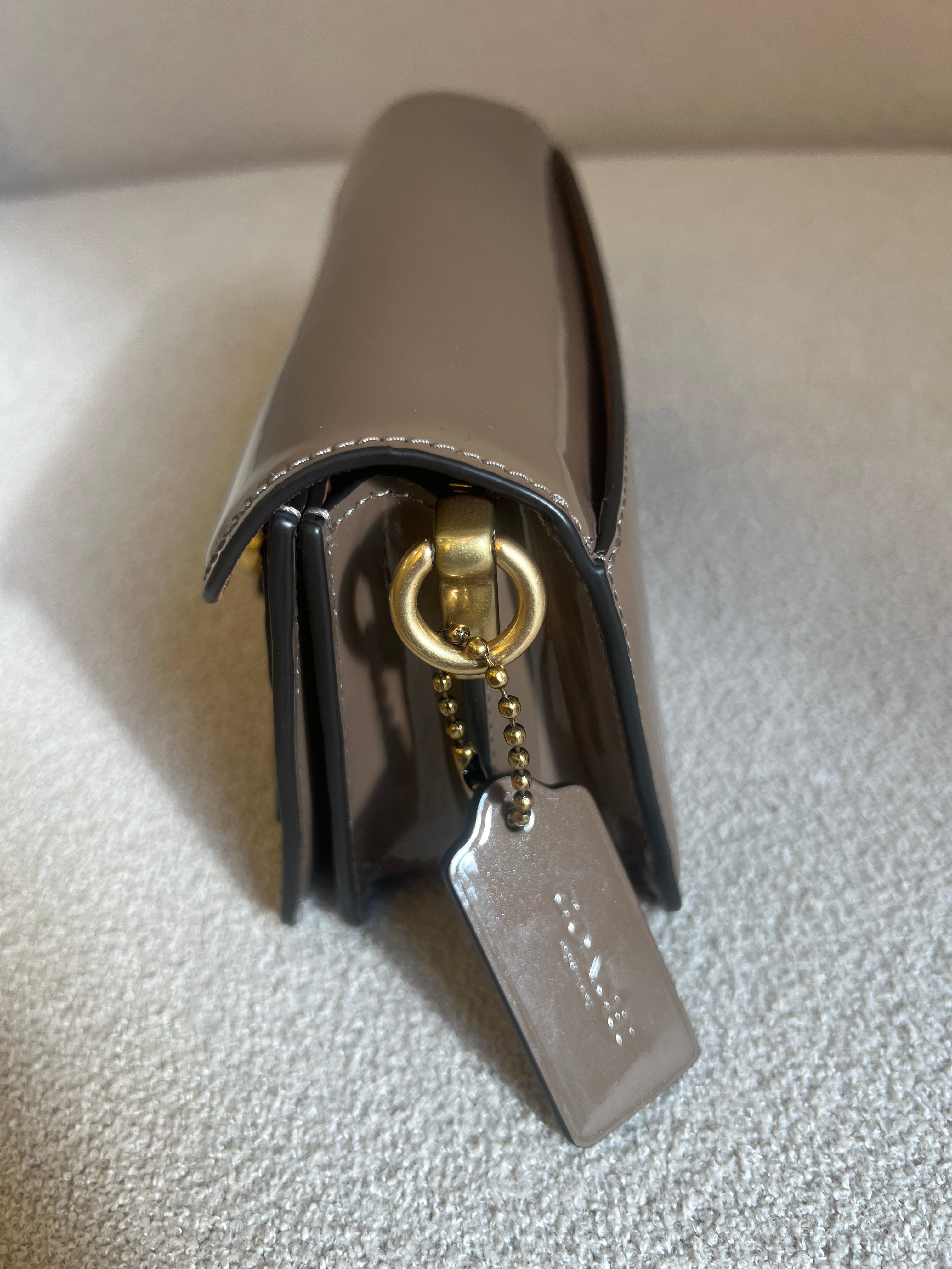 Coach Tabby Chain Clutch in dark stone patent signature leather