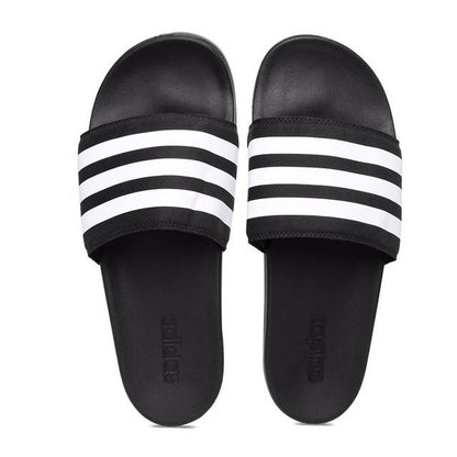 Pair of Adidas Adilette Comfort Slides in core black and white