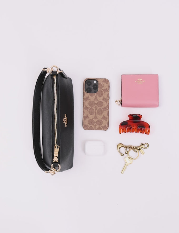 black leather Coach Charlotte shoulder bag